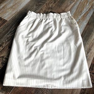 Cream coloured skirt with black pinstripes size large.